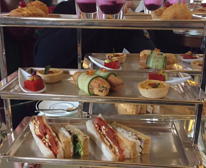 A selection of savoury sandwiches and pastries.